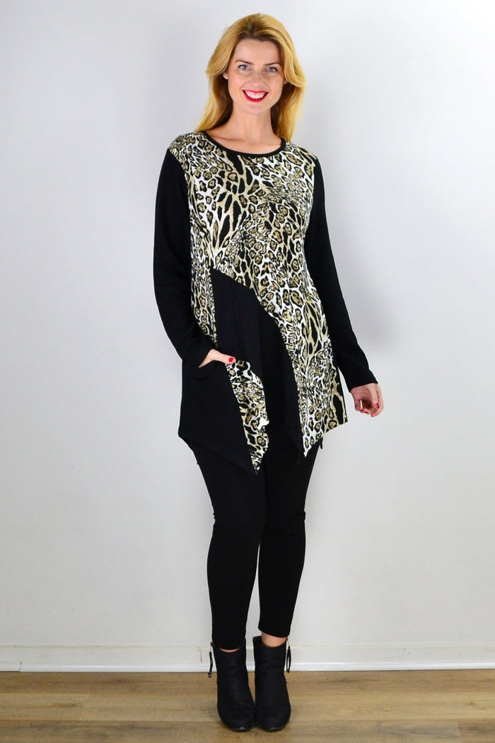 Animal print Caroline Morgan tunic top with an asymmetrical hem, displayed on a hanger.