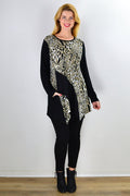 Animal print Caroline Morgan tunic top with an asymmetrical hem, displayed on a hanger.