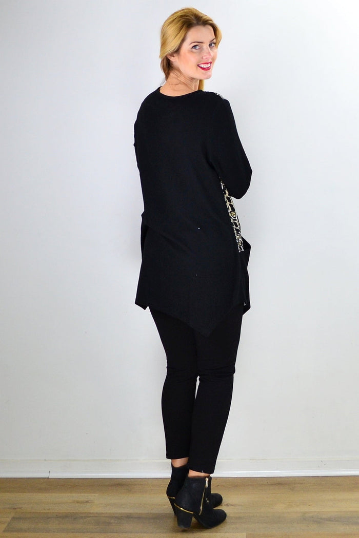 Animal print asymmetrical hem tunic top by Caroline Morgan, showcasing a stylish, flowy design with bold animal pattern details.