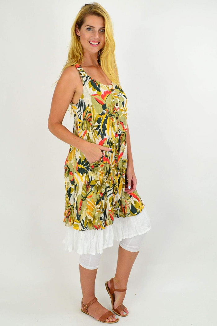 Missy Q Autumn Leaf Crinkle Tunic Dress displayed on a hanger, showcasing its fall-inspired leaf pattern and textured fabric.