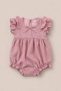 Ivy City Co’s Baby Ana Romper in Pink & Brown Gingham features flutter sleeves, a gathered waist, elastic leg openings, and a small neckline bow, shown on a neutral background.