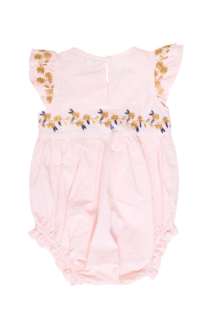 The Ivy City Co Baby Hattie Romper in Embroidered Spring Floral features a light pink cotton fabric with ruffled sleeves, gold embroidered spring floral accents along the sleeves and waist, and elastic leg openings. This romper is designed to be soft and comfortable, making it a thoughtful choice for infants or toddlers.