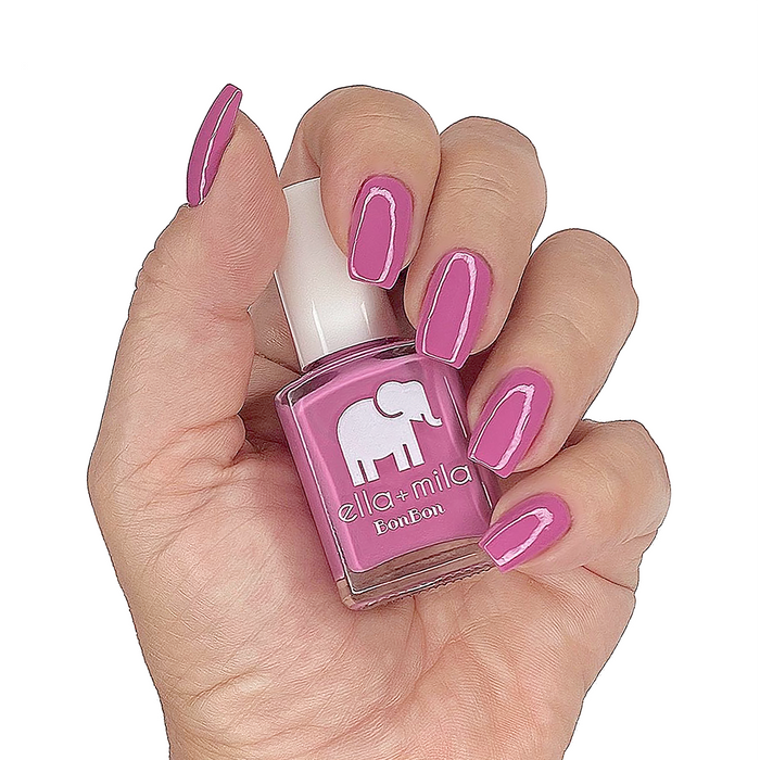 Beet Goes On bubblegum pink nail polish manicure on a light skin tone with the bottle