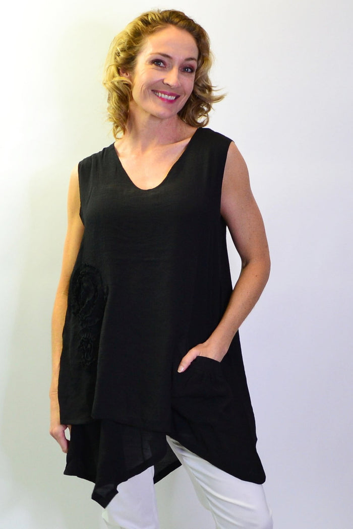 Black applique sleeveless tunic top from La Mode featuring a relaxed fit and stylish design, shown on a hanger.