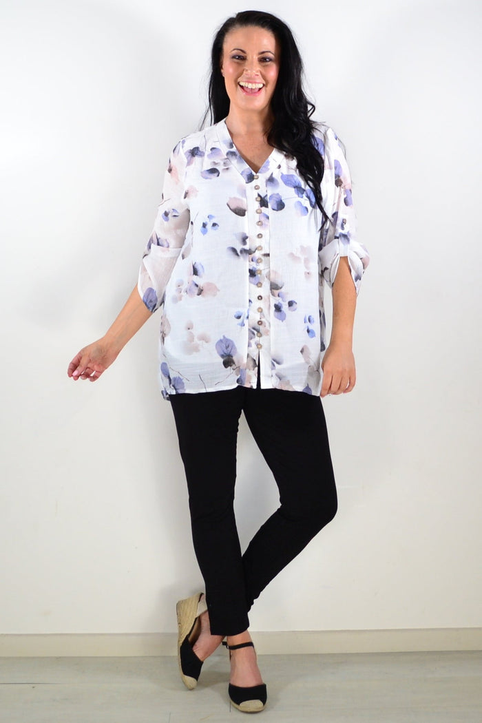 Blue floral botanical tunic top by Caroline Morgan with a relaxed fit, featuring vibrant flower and leaf patterns.