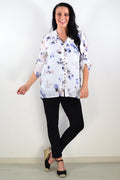 Blue floral botanical tunic top by Caroline Morgan with a relaxed fit, featuring vibrant flower and leaf patterns.