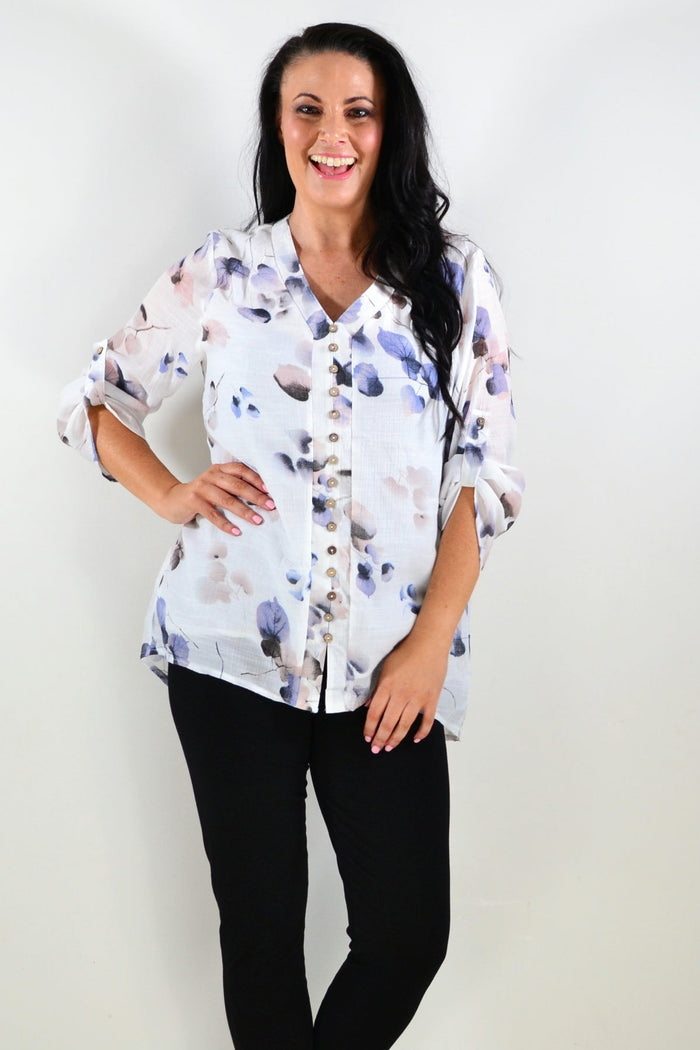 Blue floral botanical tunic top by Caroline Morgan, featuring a flowy fabric and vibrant floral pattern, perfect for casual wear.