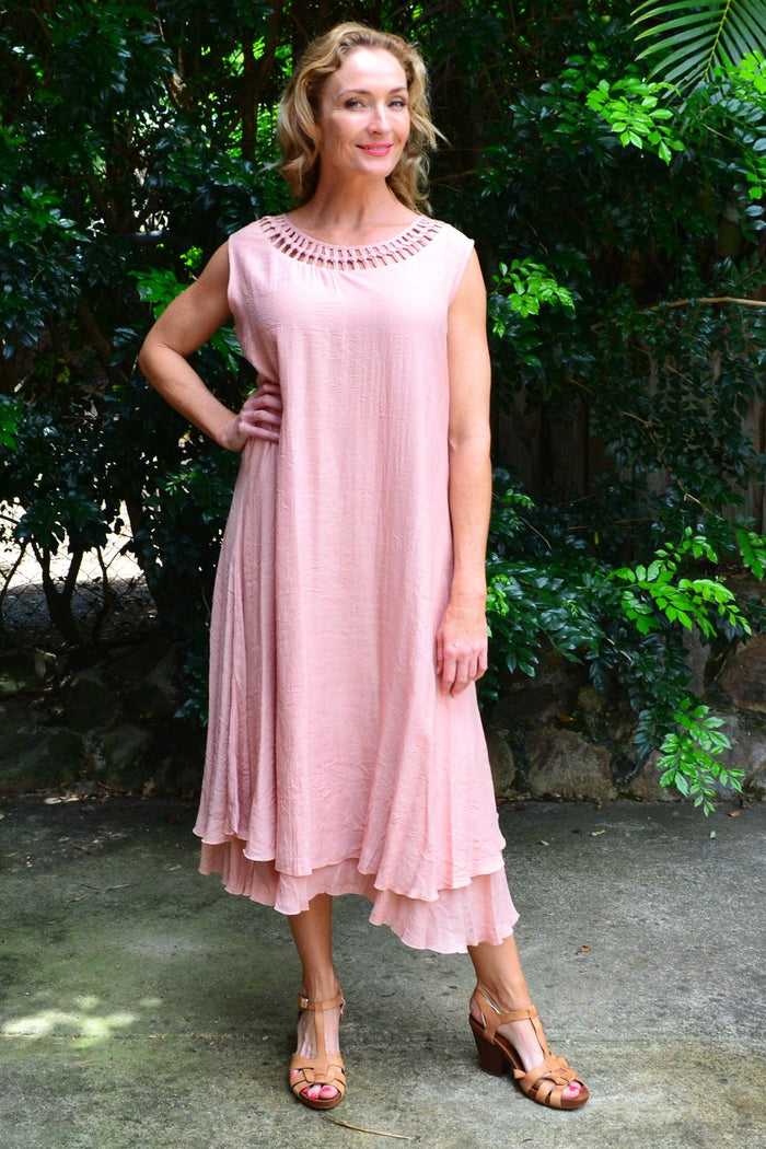Grecian sleeveless blush tunic dress by La Mode, flowing fabric with a draped, elegant silhouette and sleeveless design.
