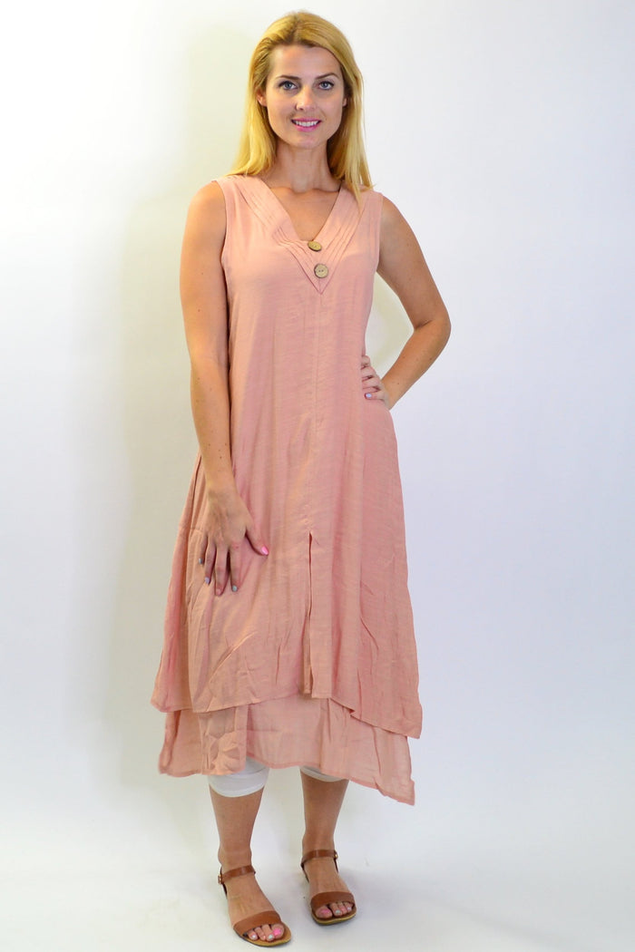 Blush pink sleeveless coconut button tunic dress by La Mode, featuring a relaxed fit and stylish design, shown on a model.