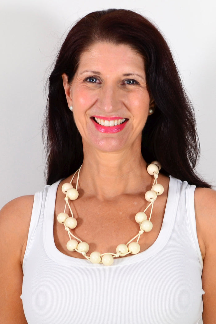 Boho cream adjustable wooden bead necklace with natural wooden beads and adjustable cord, stylish accessory from I Love Tunics.