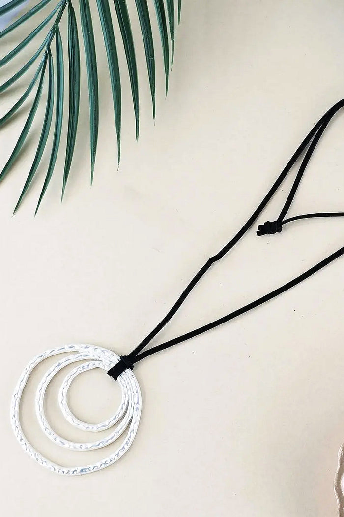 Brushed silver ring pendant necklace from I Love Tunics featuring a sleek, modern design on a delicate chain.