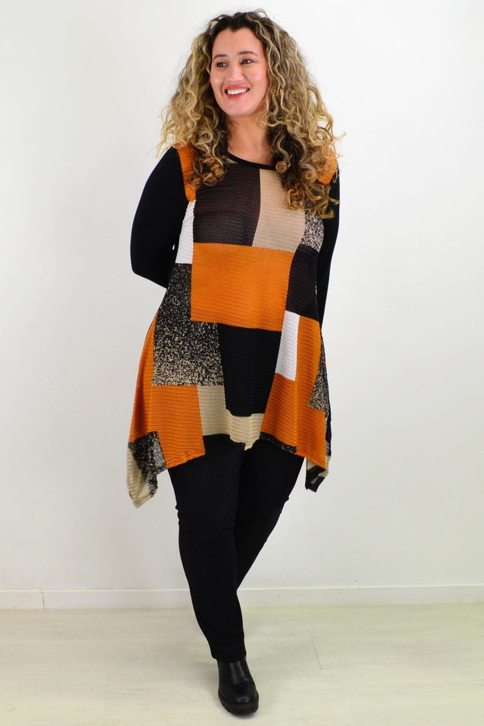 Caramel Caroline Morgan swing tunic top displayed on a hanger, showcasing its flowy fabric and relaxed fit.