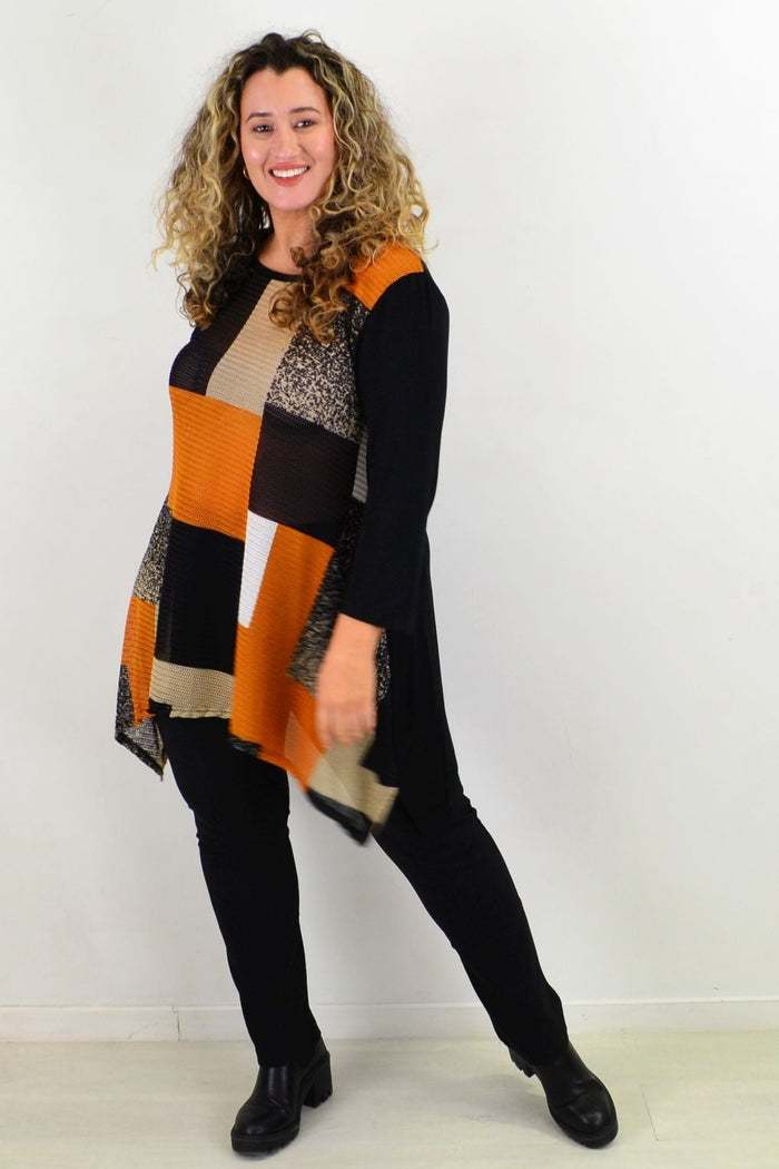 Caramel Caroline Morgan swing tunic top with long sleeves and relaxed fit, displayed on a hanger against a plain background.
