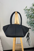 black leather baguette style bag