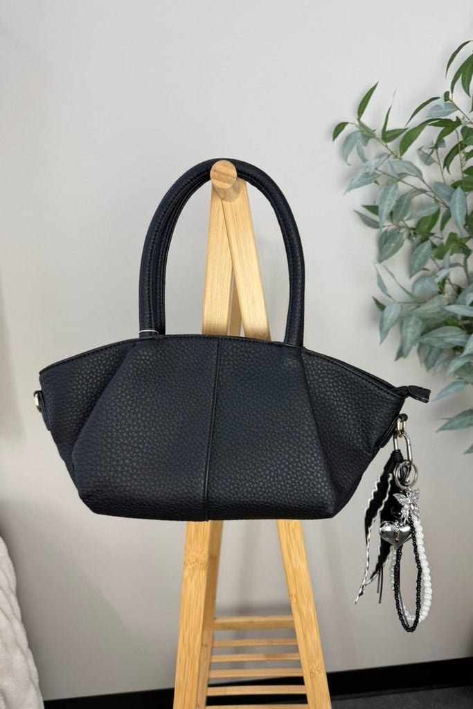 black leather baguette style bag
