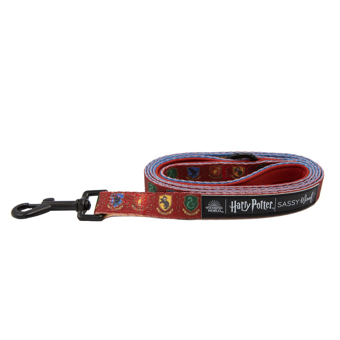 The Dog Leash - Harry Potter™ by Sassy Woof features the four Hogwarts house crests, a black metal clasp, and dual logos—a magical accessory for any Harry Potter fan and their pet.