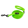The Sassy Woof Dog Leash - Neon Green features a padded handle, sturdy black metal clasp, and a branded black tag—making it a vibrant, comfortable, and eye-catching accessory for your dog.