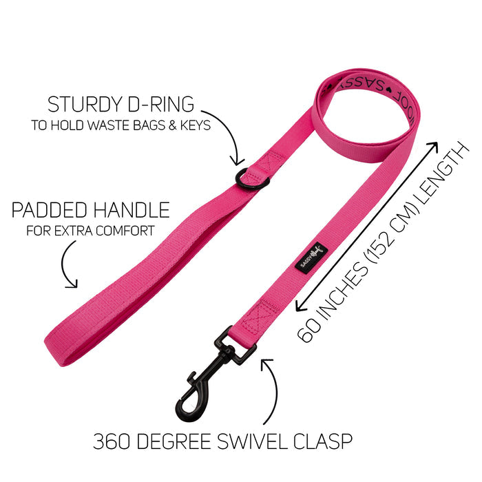 The Sassy Woof Dog Leash - Neon Pink features neoprene, a padded handle, sturdy D-ring, 360° swivel clasp, and is 60 inches (152 cm) long. Perfect with an adjustable harness or neon accessories. Arrows highlight each feature.