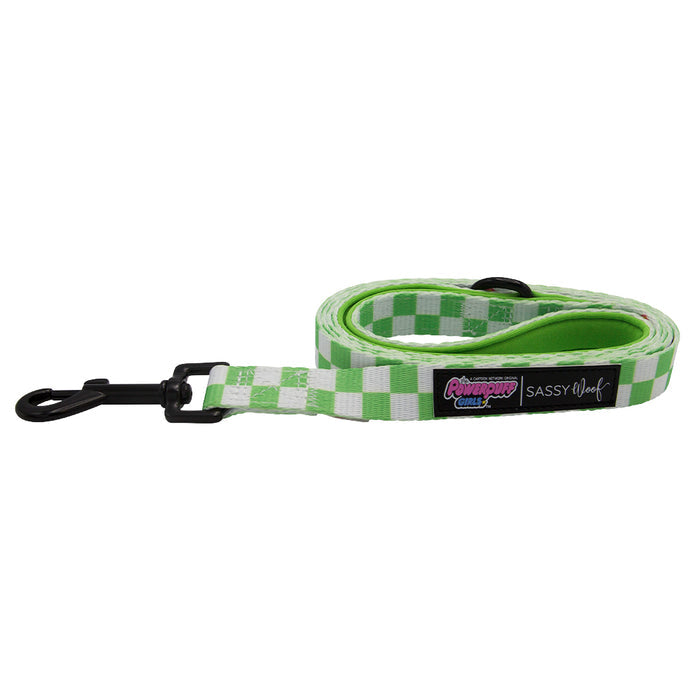 The Sassy Woof Dog Leash - The Powerpuff Girls™ (Green) features a green and white checkered design, padded handle, black clasp, Sassy Woof label, and a colorful Powerpuff Girls patch.