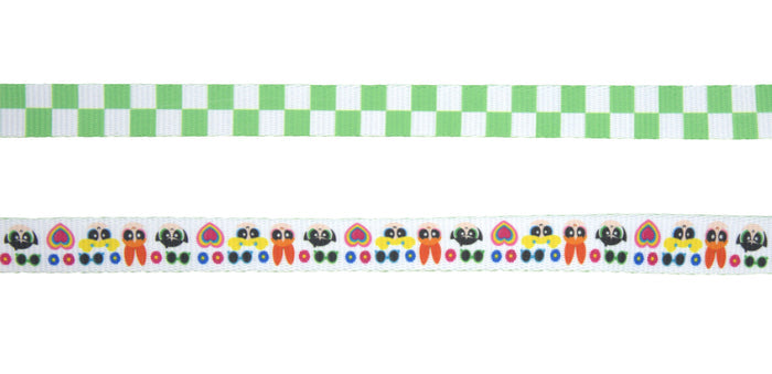 Two horizontal ribbons: the top with a green and white checkered pattern, the bottom with colorful caterpillars, hearts, and dots—perfect for accenting an adjustable harness or the Sassy Woof Dog Leash - The Powerpuff Girls™ (Green).