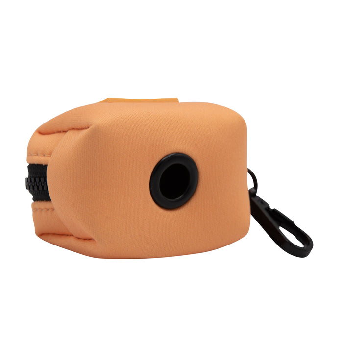 Displayed against a white background, the Sassy Woof Dog Waste Bag Holder - Adventure Orange is an orange neoprene pouch with a zippered closure, central round opening, and black plastic clip for convenient waste bag storage.