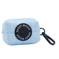The Dog Waste Bag Holder - Blumond by Sassy Woof is a light blue textured neoprene accessory with a black SASSY WOOF label and clip, making it the perfect waste bag holder for walks.