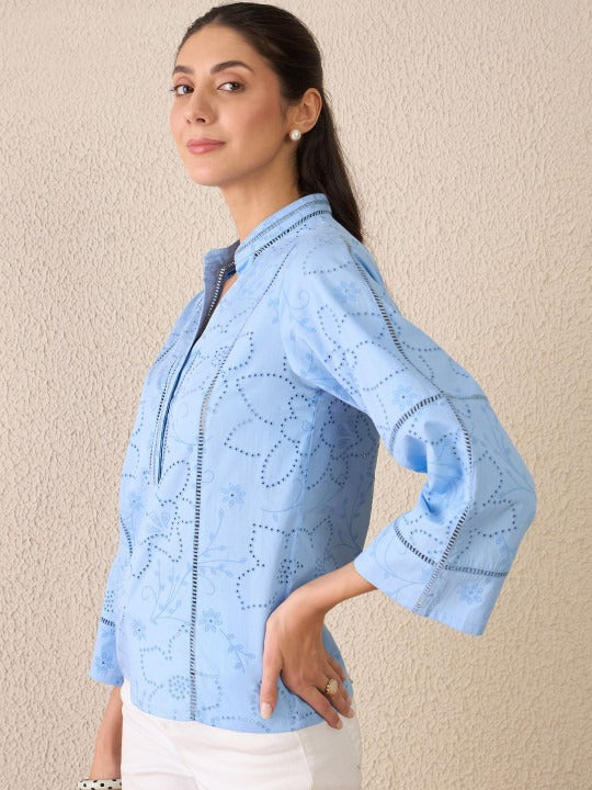Elegant floral embroidery with a breathable woven cotton finish