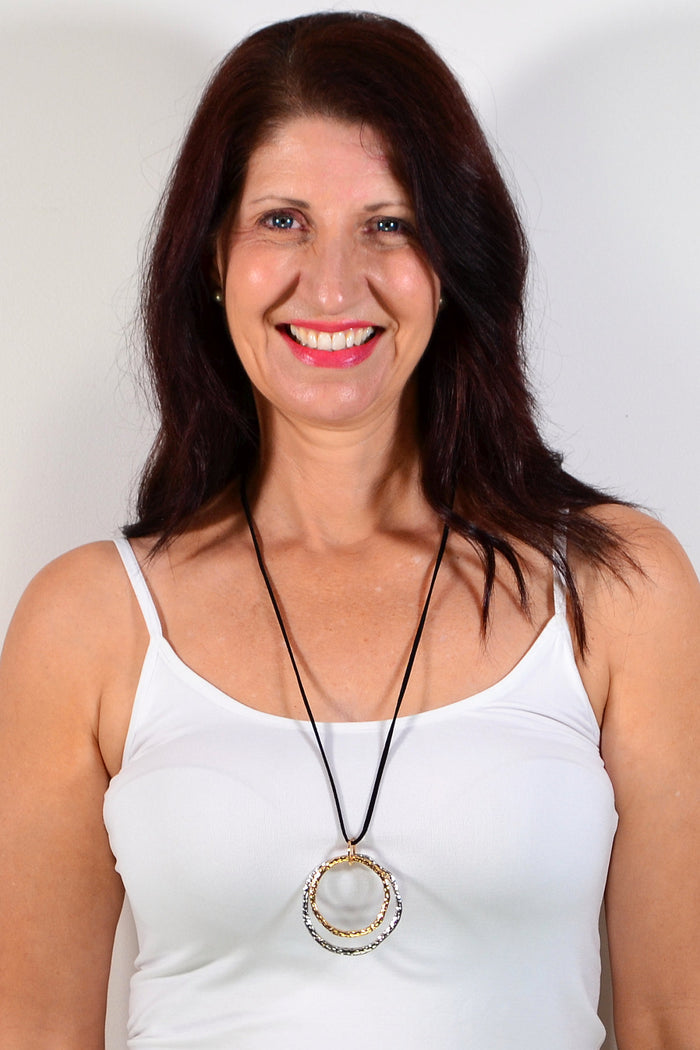Golden and silver twin rings pendant necklace featuring a circular design, crafted by I Love Tunics.