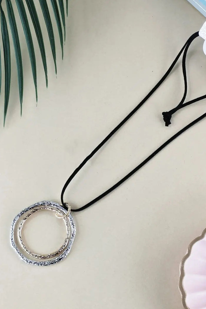 Golden and silver twin rings pendant necklace by I Love Tunics with a sleek, elegant design, featuring two intertwined rings.