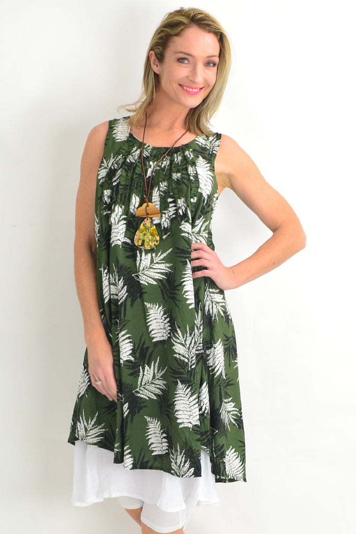 Green frilly Fern Tunic Dress by Willow Tree, featuring a flowy silhouette with ruffled details and botanical print fabric.