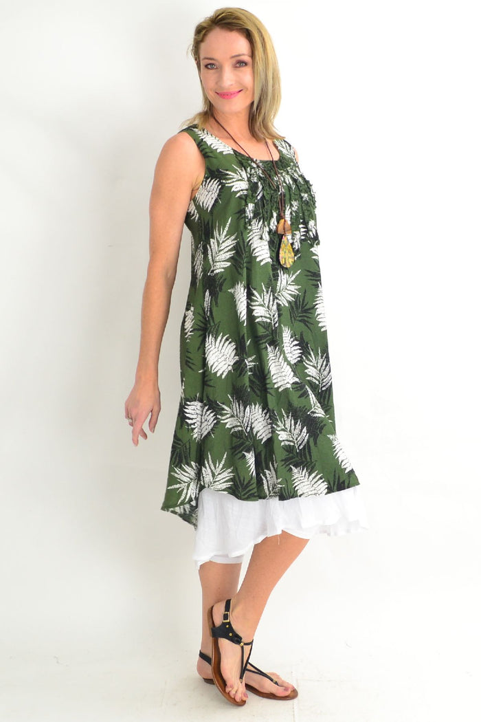 Green frilly Fern Tunic Dress by Willow Tree, featuring a flowy silhouette and delicate frill details, displayed on a hanger.