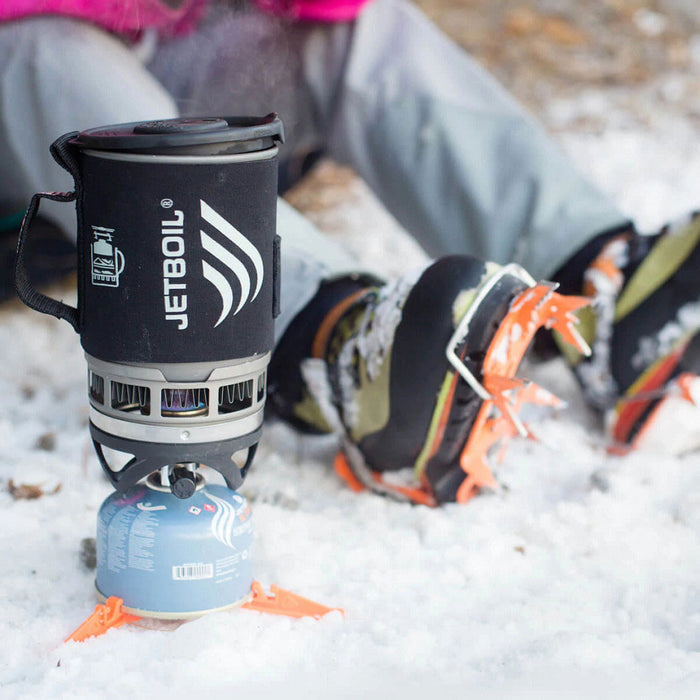 Lifetsyle image of a Jetboil Zip gas camping stove being used in the snow