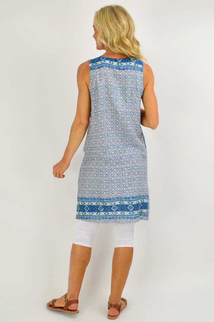Blue Leon Pleat Pocket Tunic Dress by Orientique featuring pleats and side pockets, displayed on a hanger.