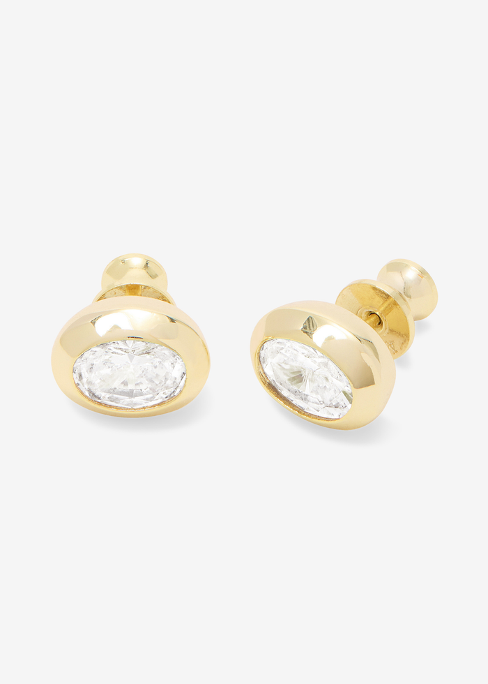 Gold framed oval shaped simulated diamond earrings on a white background