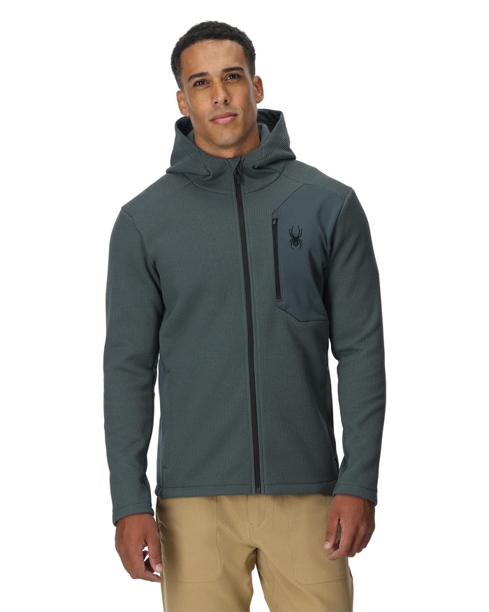 Man wearing a gray jacket with a hood on a white background
