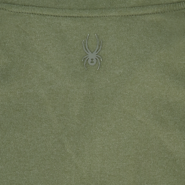 Close-up of a green fabric with a spider logo on it