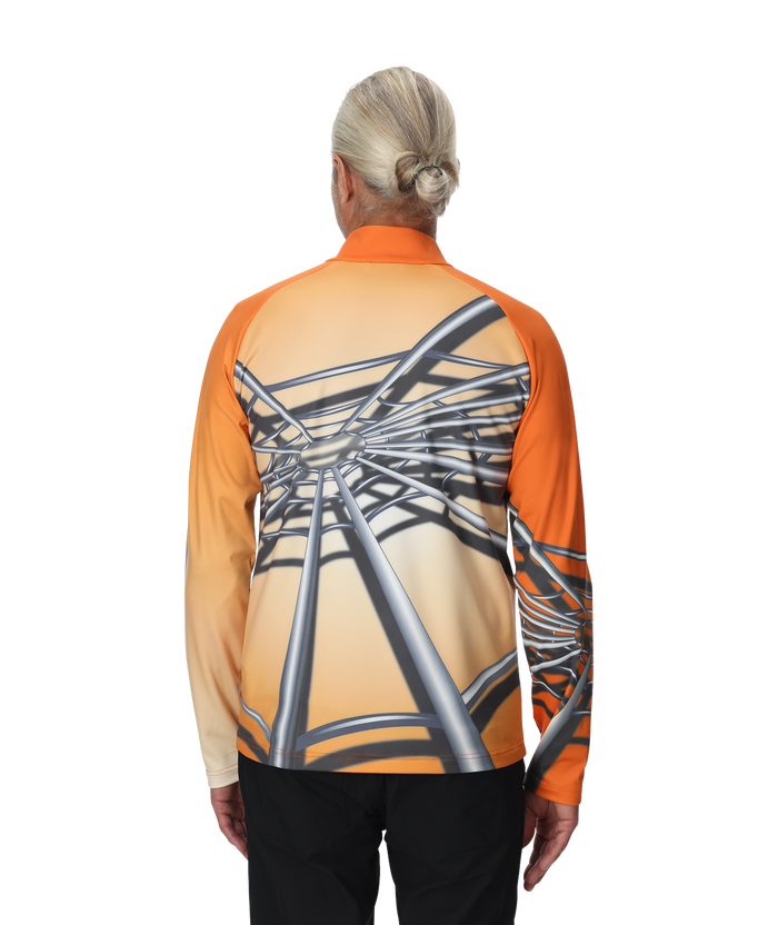 Person wearing an orange and black long-sleeve shirt with a unique design on the back, on a white background.