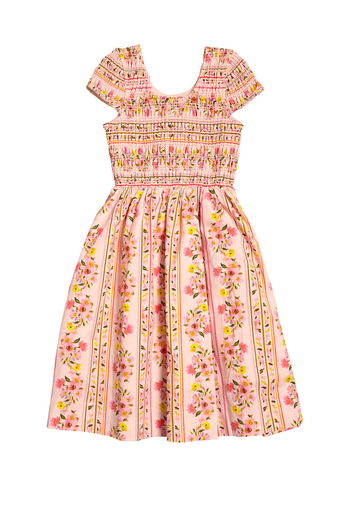 The Mini Marlow Cap Sleeve Dress in Peach Handpainted Flora Stripe by Ivy City Co is a girls’ pink spring dress with short sleeves, a smocked bodice, and a flared skirt featuring vertical stripes and floral patterns.