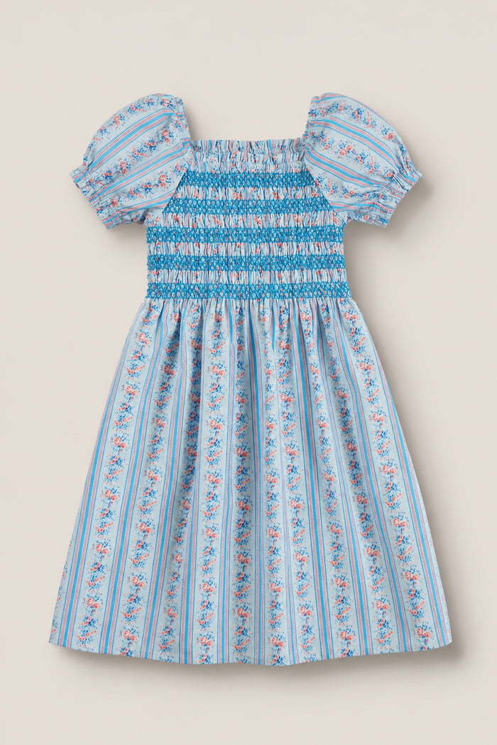 The Mini Sunday Best Dress in Rosette Linear Stripe by Ivy City Co features puff sleeves, a smocked bodice, and a gathered skirt with pink and white floral patterns—ideal for Mom and Me matching moments.