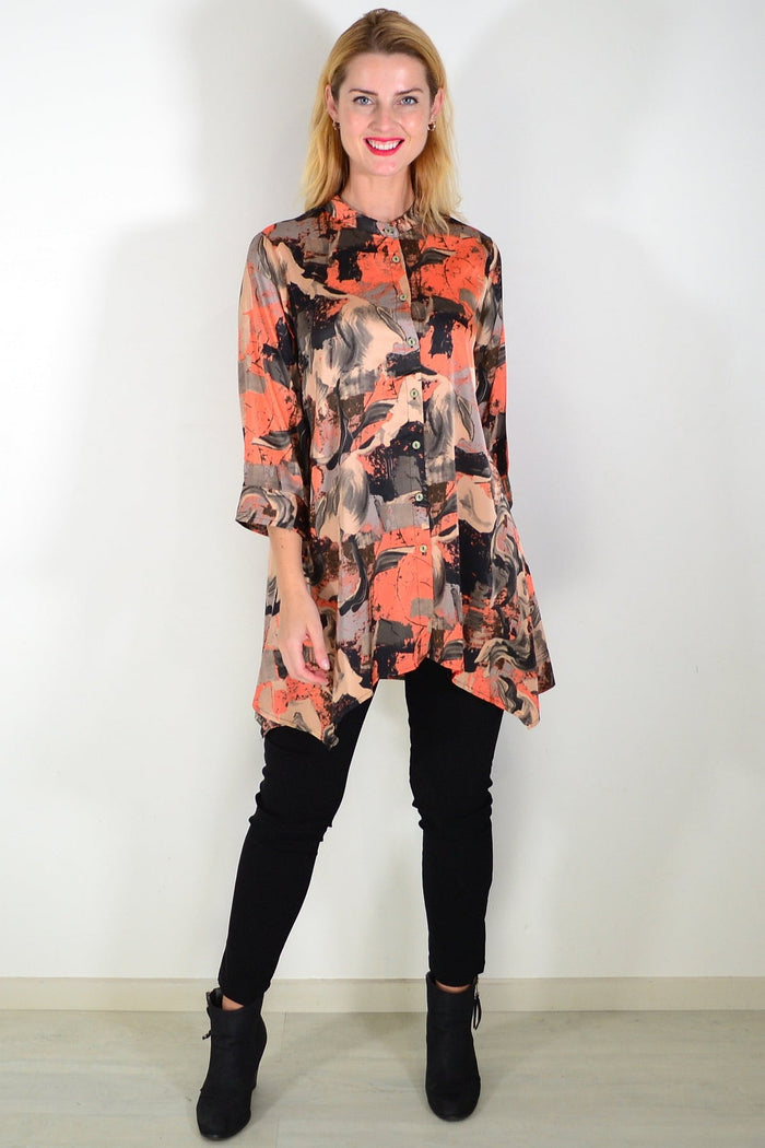 Orange beige satin tunic shirt by Caroline Morgan, featuring a relaxed fit with elegant drape and subtle sheen, shown on a model.