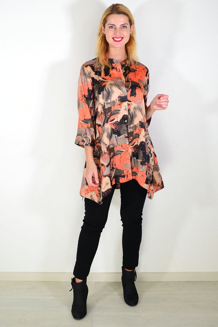 Orange beige satin tunic shirt by Caroline Morgan with long sleeves and a relaxed fit, displayed on a hanger.