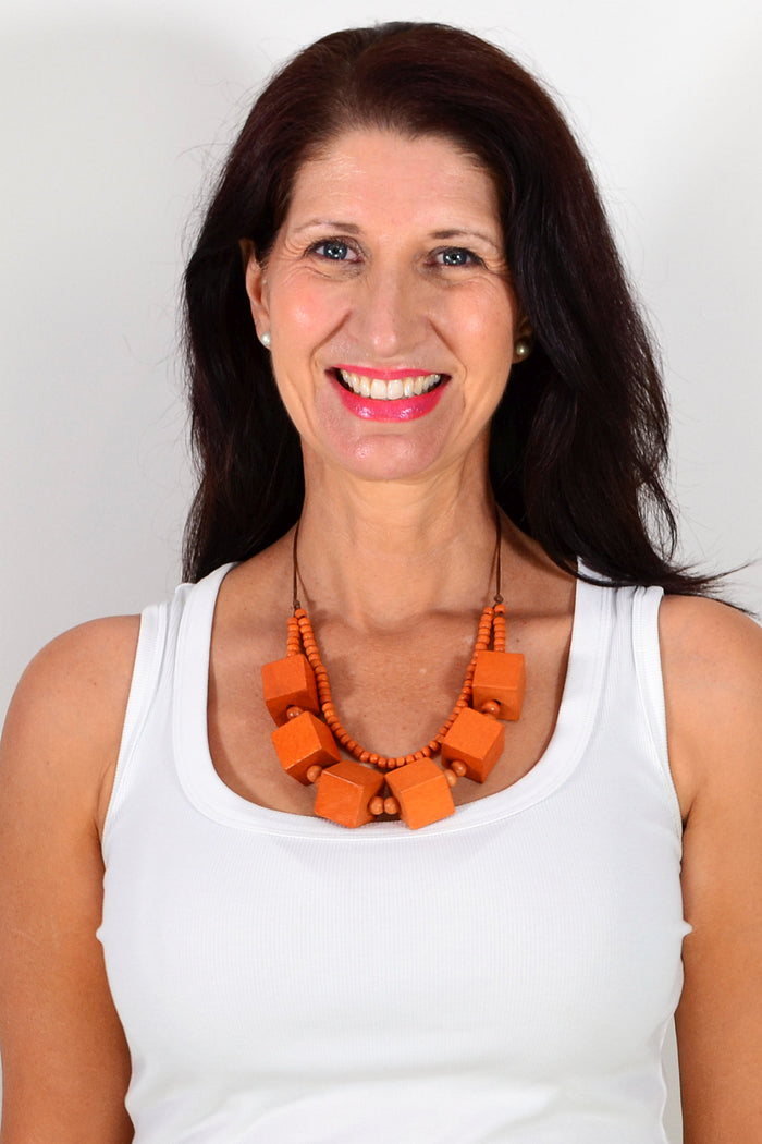 Orange square blocks necklace by I Love Tunics featuring bold geometric pendant on a silver chain.