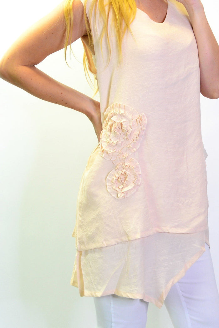 Peach sleeveless tunic top with applique details from La Mode, showcasing a flowy, lightweight design and elegant style.