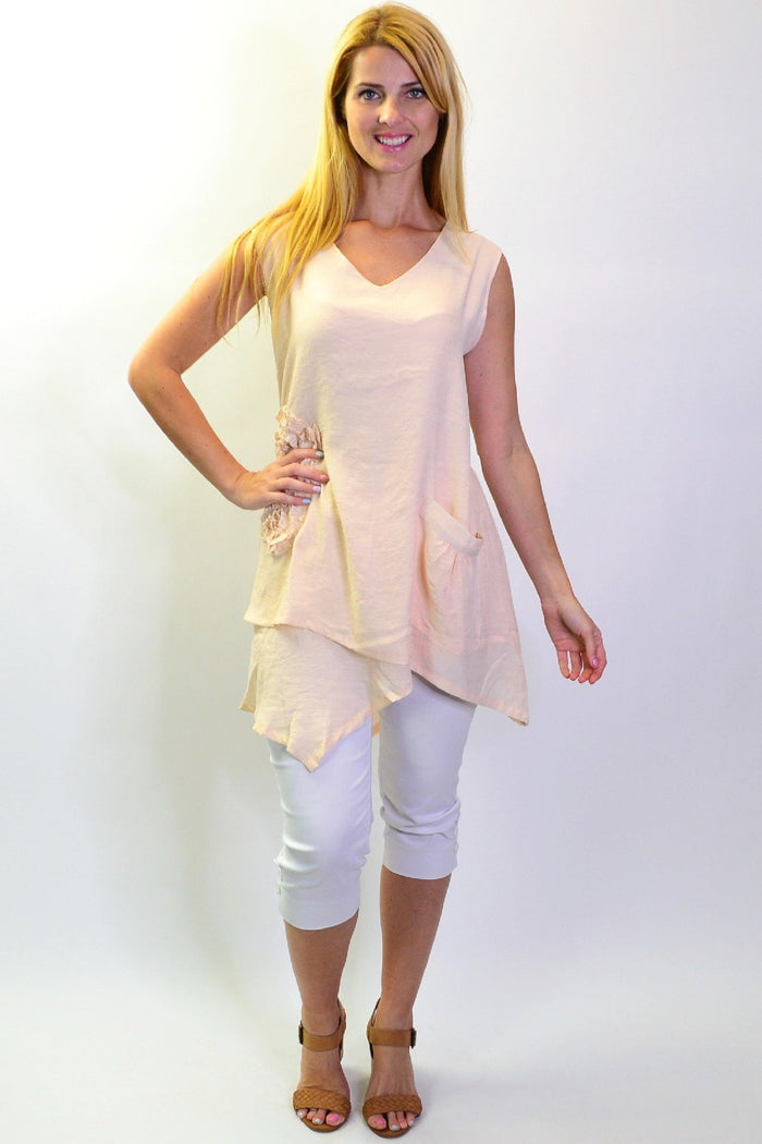 Peach sleeveless tunic top with applique details from La Mode, displayed flat on a white background.