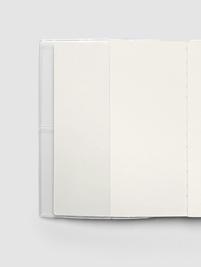 View of inside cover of notebook with cover page inserted into clear vinyl notebook cover inner pocket.