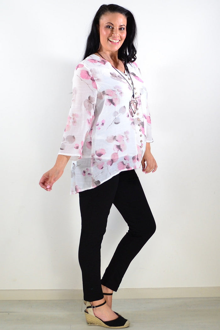 Pink floral botanical tunic top by Caroline Morgan with a flowy design and vibrant floral pattern.
