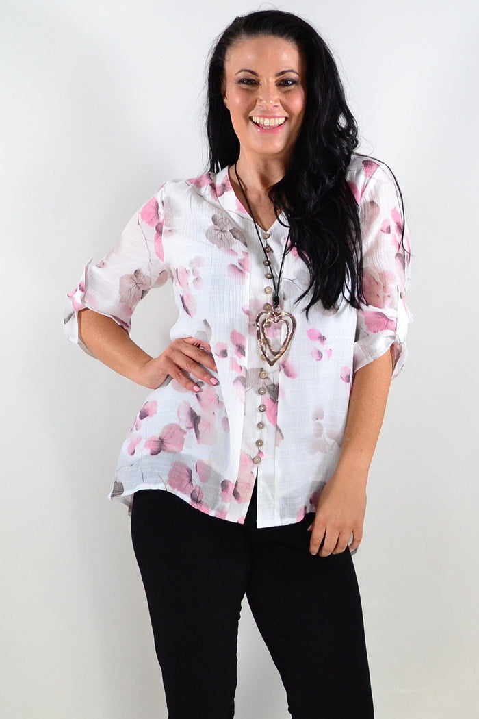 Pink floral botanical tunic top by Caroline Morgan featuring a relaxed fit and vibrant flower print.