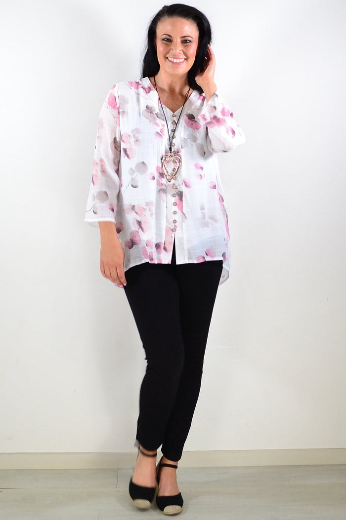 Pink floral botanical tunic top by Caroline Morgan, featuring a flowy design with vibrant flower and leaf patterns.