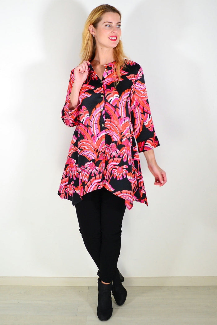 Pink orange satin tunic shirt by Caroline Morgan, featuring a smooth, shiny fabric and a relaxed fit.