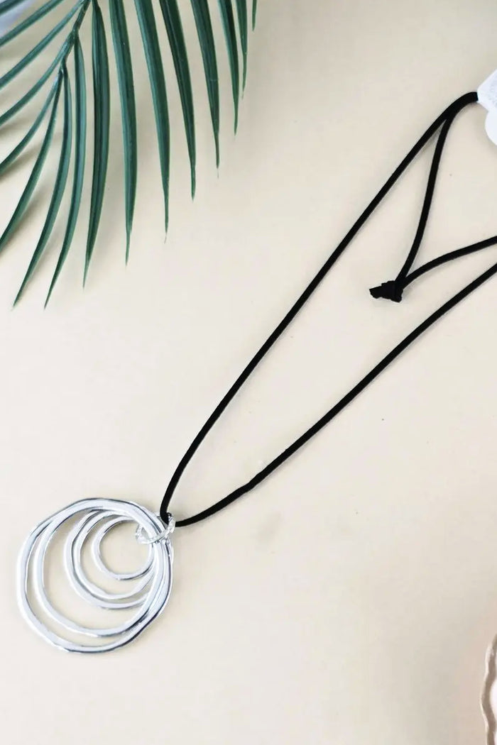 Polished chrome ring pendant necklace from I Love Tunics with a sleek, shiny circular pendant on a delicate chain.